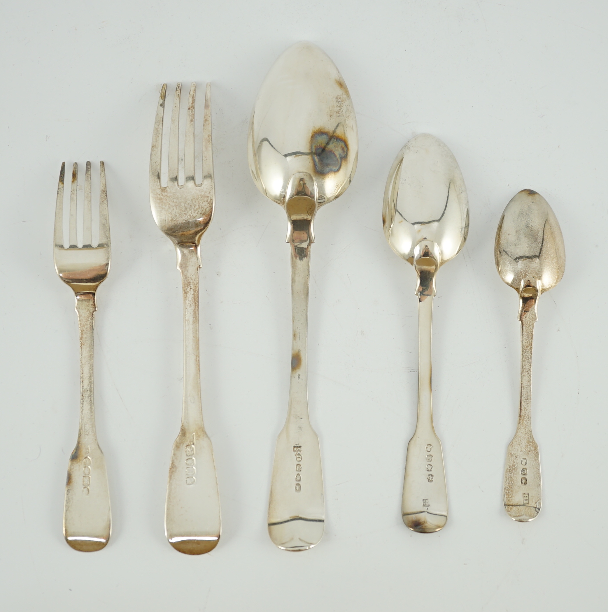 A matched canteen of early 19th century silver fiddle pattern flatware for twelve